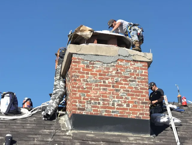 Old Saybrook Chimney Sweep installing a custom chimney crown in Old Saybrook, CT