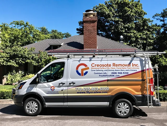 Old Saybrook Chimney Sweep technician removing creosote safely in Old Saybrook, CT