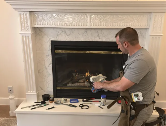 Old Saybrook Chimney Sweep performing fireplace maintenance in Old Saybrook, CT